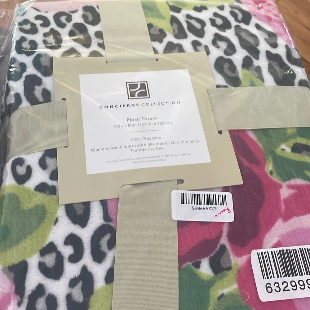 NWOT. Never opened. Plush Throw blanket 50in by 60in. 100% polyester.
